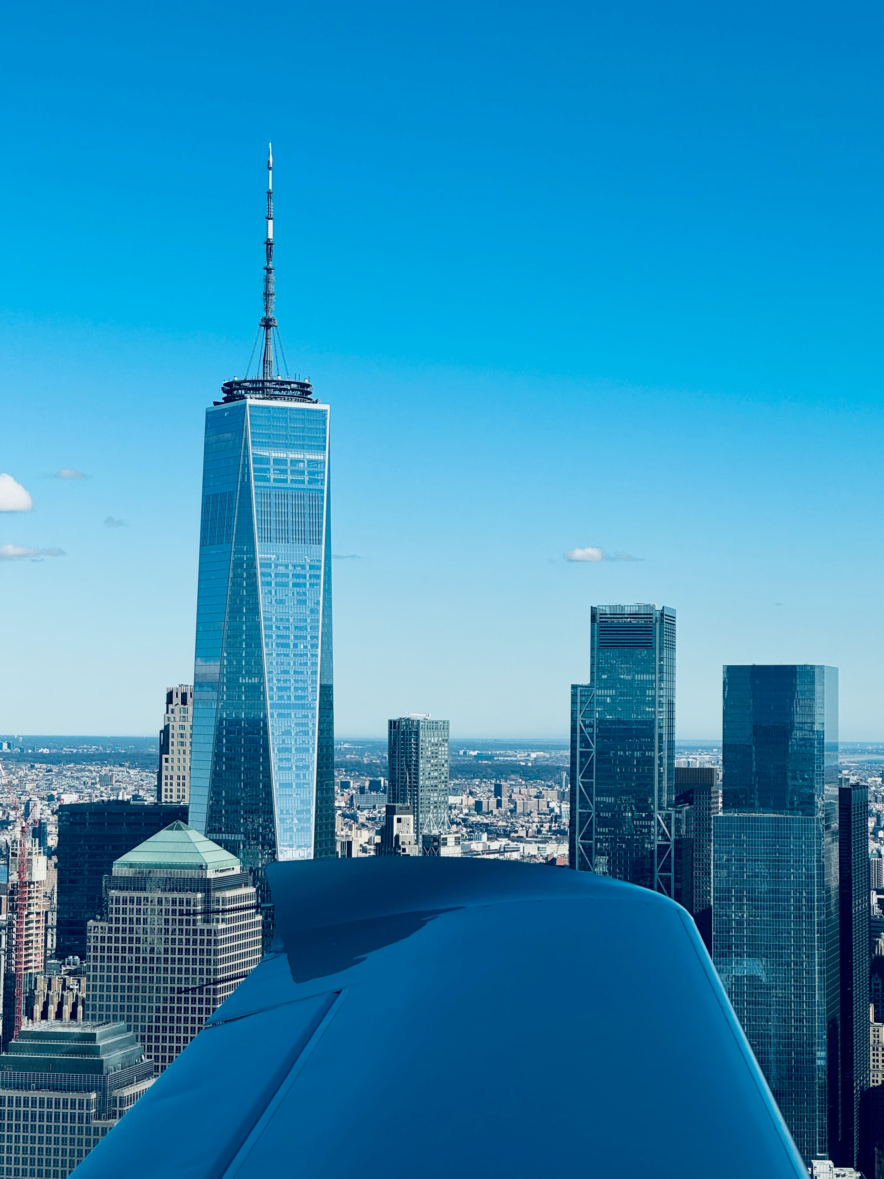Lower Manhattan and One World Trade Center seen over an aircraft cowling